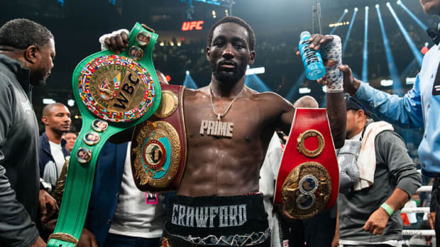 Terence Crawford has his hand raised, finishing Errol Spence Jr. in Las Vegas.